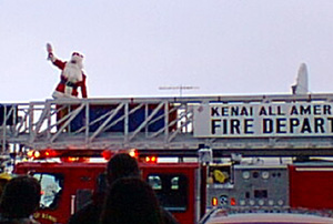 what? doesn't Santa ride a fire truck in YOUR town?